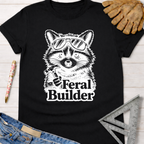 Black Feral Builder T-shirt with a raccoon in sunglasses holding a hammer. Women's funny woodworking graphic tee shirt for female woodworkers, makers, and DIY builders — Sawdust & Ponytails.