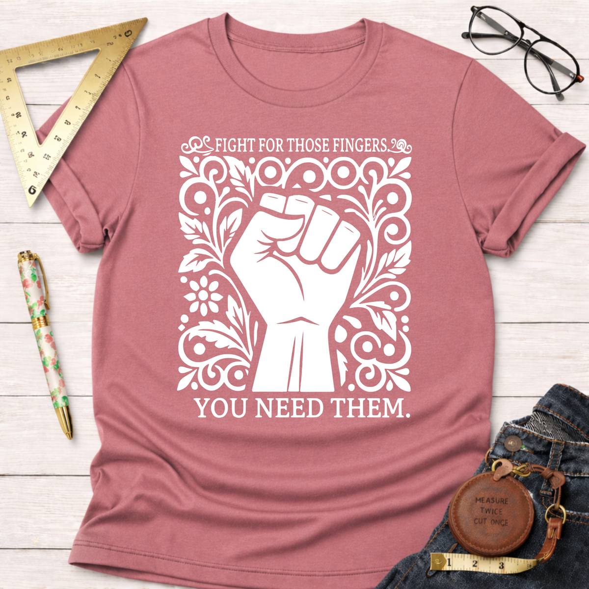 Heather dusty rose t-shirt with "Fight For Those Fingers You Need Them" text and a white fist graphic.