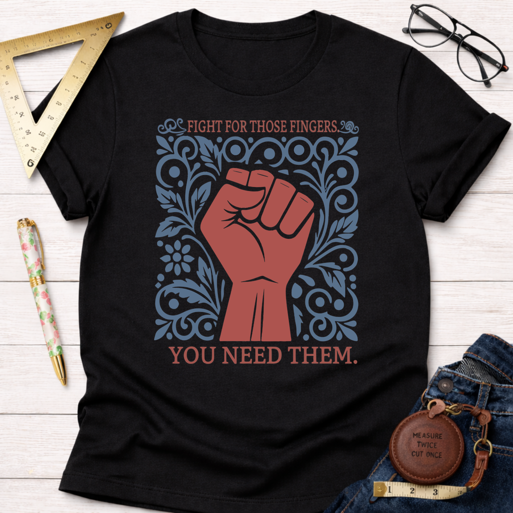 Black cotton t-shirt with a red fist and blue floral design, text reads "Fight For Those Fingers. You Need Them.