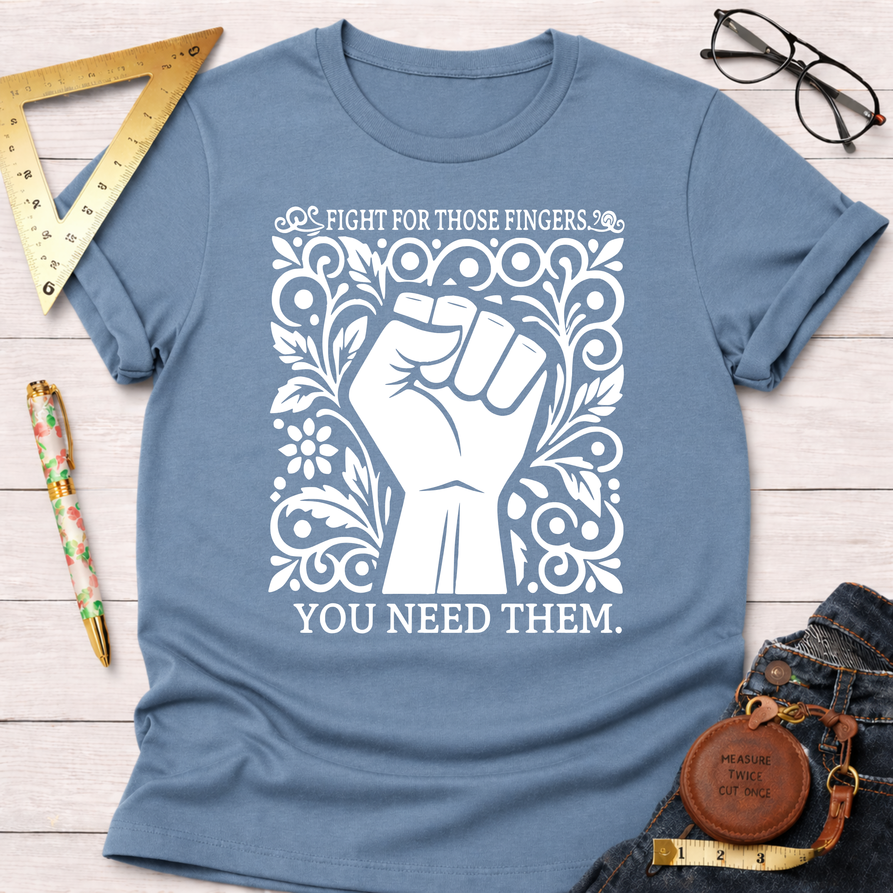 Light blue cotton t-shirt with "Fight For Those Fingers You Need Them" text and a white fist design.