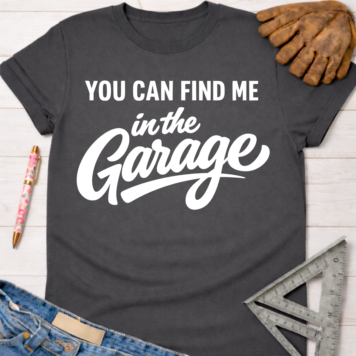 Charcoal gray women's "YOU CAN FIND ME in the Garage" graphic tee. Women's funny woodworking graphic tee shirt for female woodworkers, makers, and DIY builders — Sawdust & Ponytails