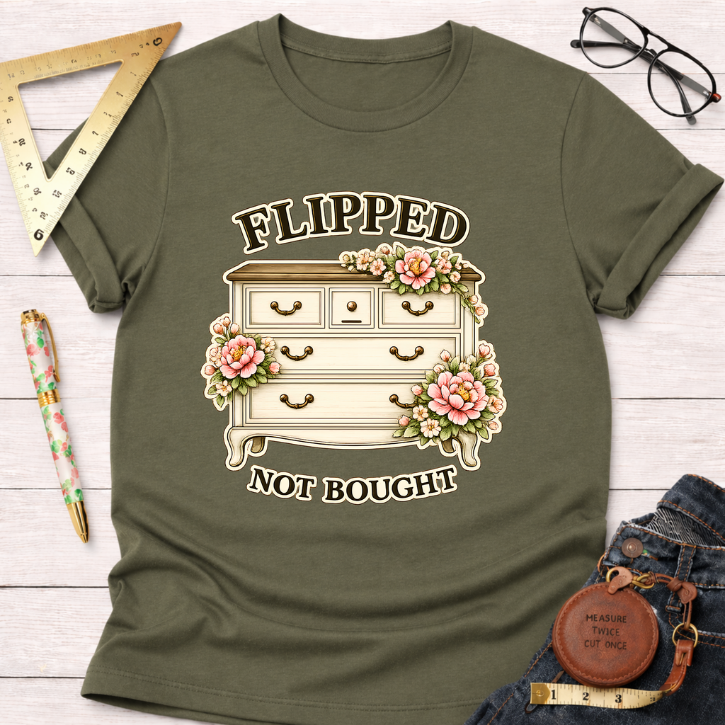 Olive green "Flipped Not Bought" t-shirt with a vintage floral dresser graphic.