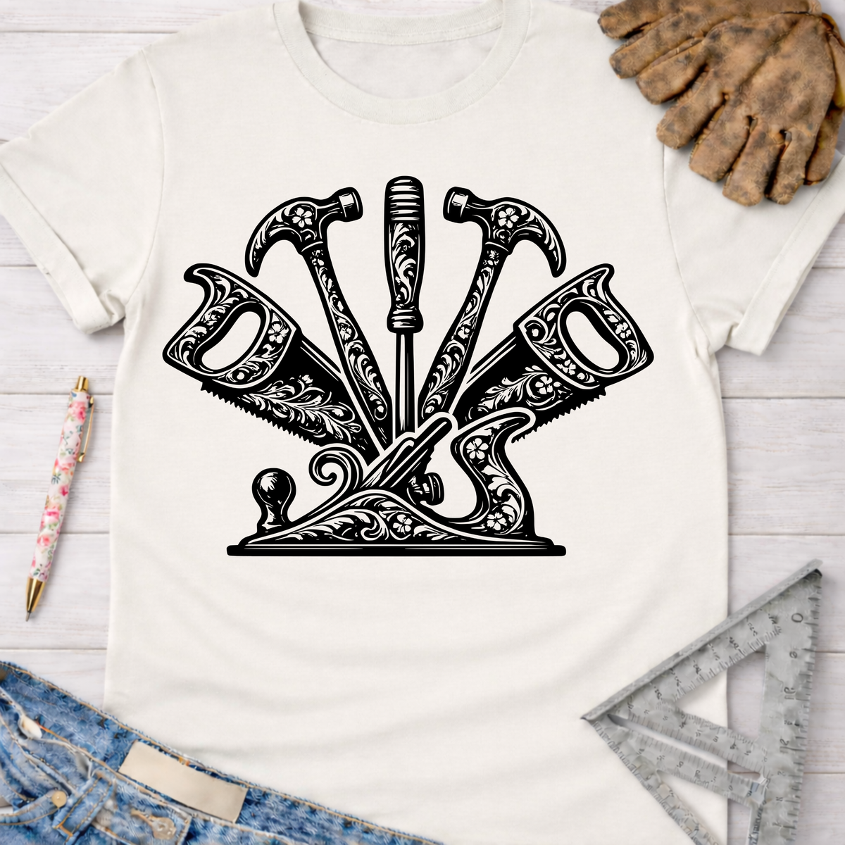 Women's funny woodworking graphic tee shirt for female woodworkers, makers, and DIY builders — Sawdust & Ponytails. White cotton tee with ornate black floral tool graphic.