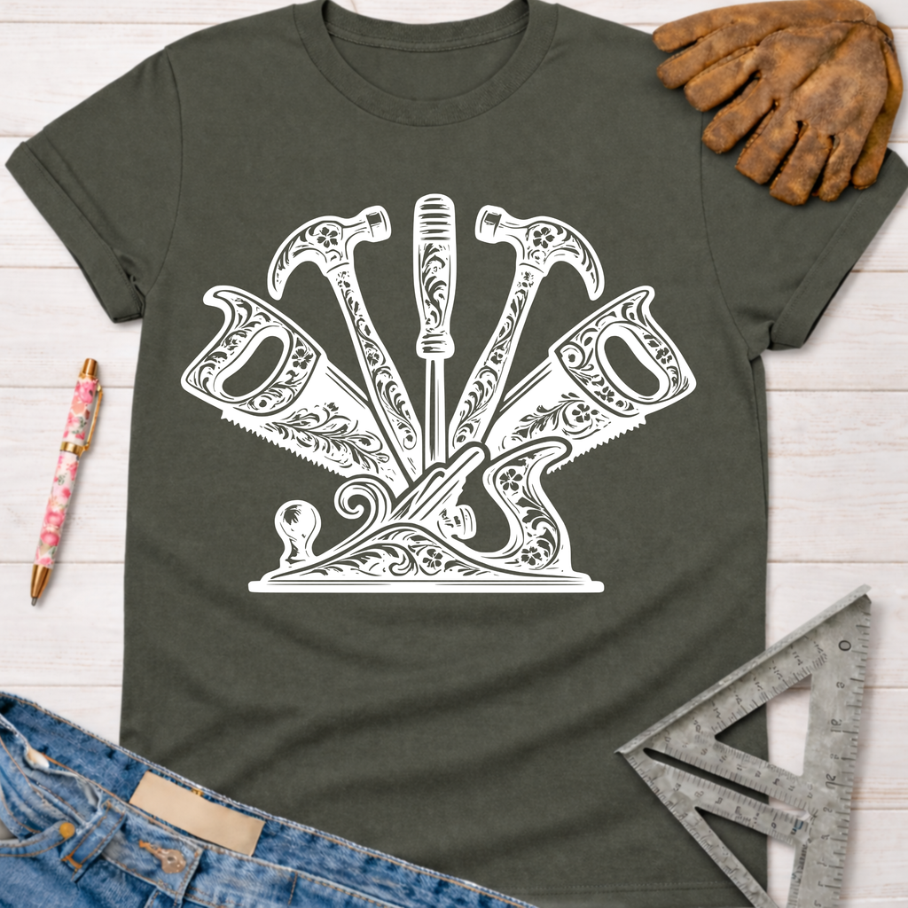 Women's funny woodworking graphic tee shirt for female woodworkers, makers, and DIY builders — Sawdust & Ponytails. Dark gray tee with white ornate floral tools design.