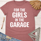 Women's funny woodworking graphic tee shirt for female woodworkers, makers, and DIY builders — Sawdust & Ponytails. Mauve t-shirt with "FOR THE GIRLS IN THE GARAGE" in white text.