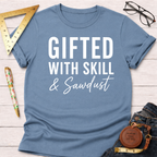 Blue crew neck t-shirt with "Gifted With Skill & Sawdust" in white text, styled with jeans and tools.
