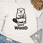 Women's funny woodworking graphic tee shirt for female woodworkers, makers, and DIY builders — Sawdust & Ponytails. White cotton tee with a black beaver holding wood and "GOT WOOD" text.