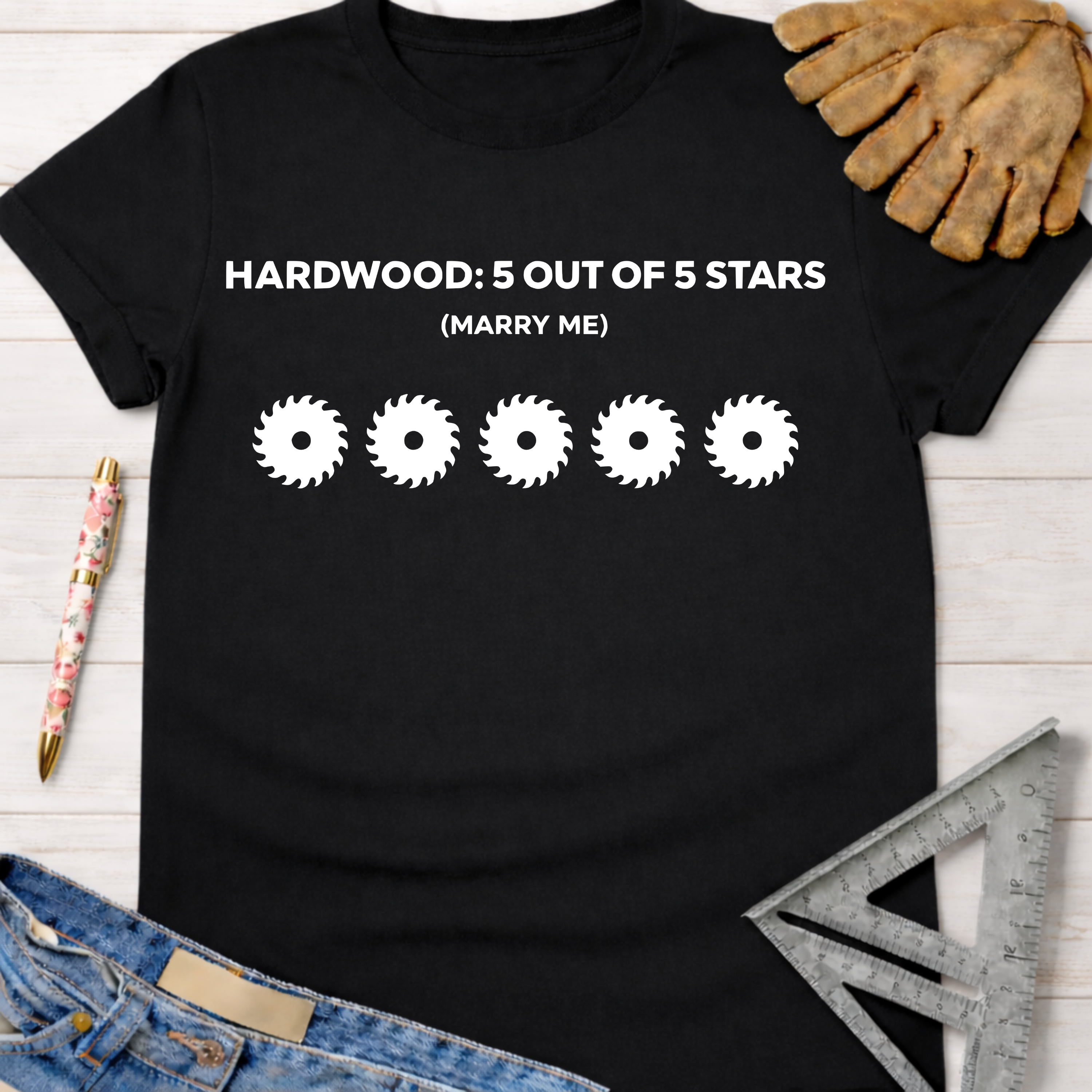 Black cotton tee with "HARDWOOD: 5 OUT OF 5 STARS (MARRY ME)" and five saw blade graphics. Women's funny woodworking graphic tee shirt for female woodworkers, makers, and DIY builders — Sawdust & Ponytails