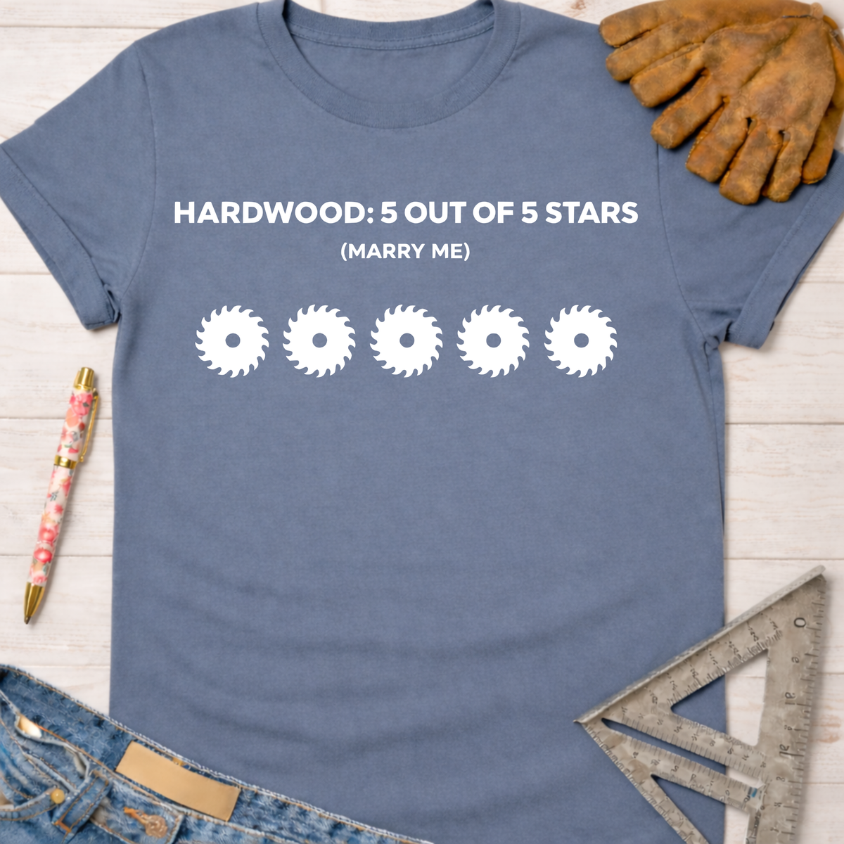 Blue cotton women's funny woodworking graphic tee with "HARDWOOD: 5 OUT OF 5 STARS (MARRY ME)" and five saw blades.