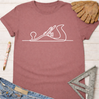 Women's funny woodworking graphic tee shirt for female woodworkers, makers, and DIY builders — Sawdust & Ponytails. Mauve t-shirt with white hand planer line art.
