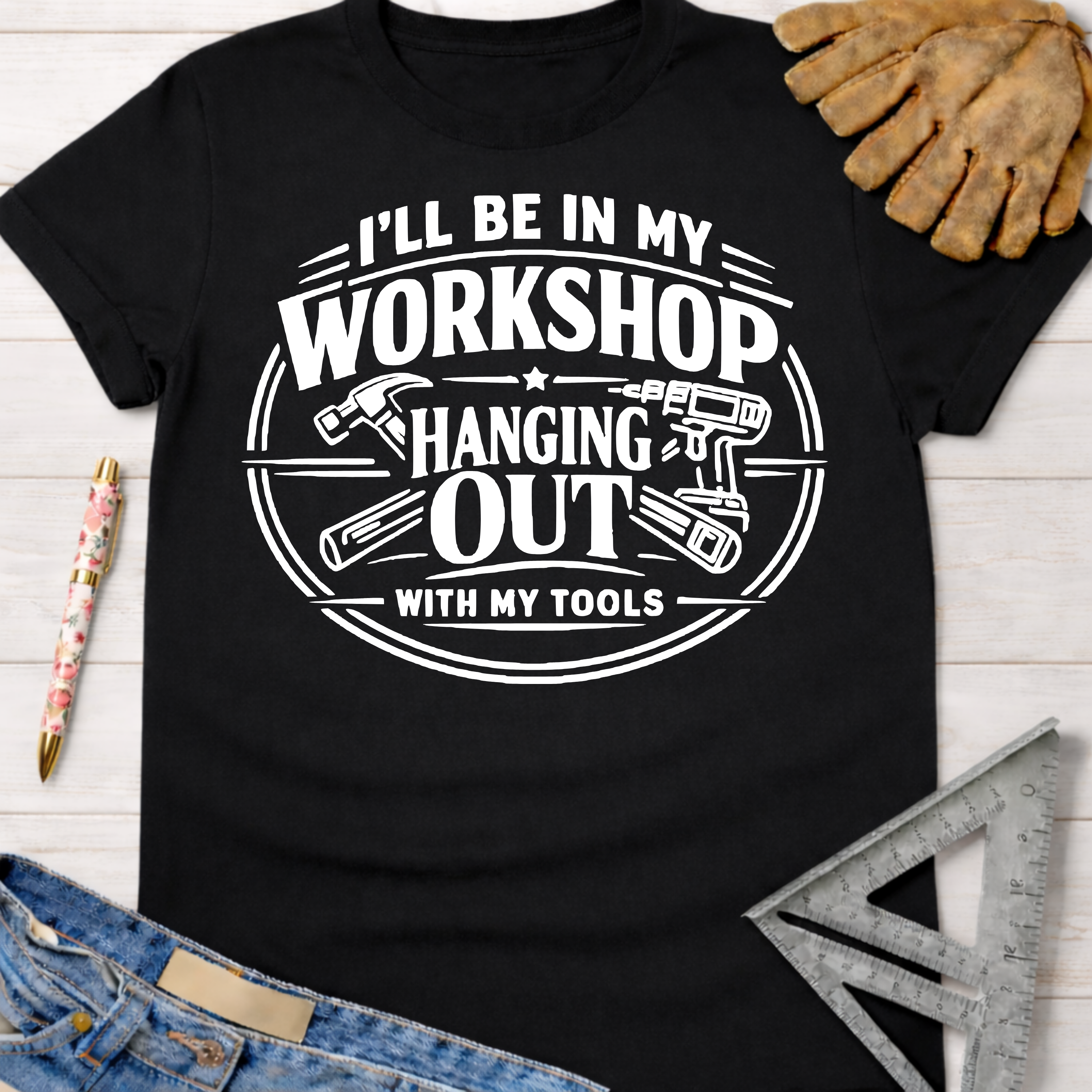 Black cotton tee with "I'll Be In My Workshop Hanging Out With My Tools" graphic. Women's funny woodworking graphic tee shirt for female woodworkers, makers, and DIY builders — Sawdust & Ponytails