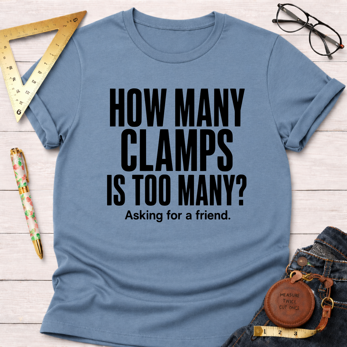 Blue t-shirt with "HOW MANY CLAMPS IS TOO MANY? Asking for a friend." in black text.