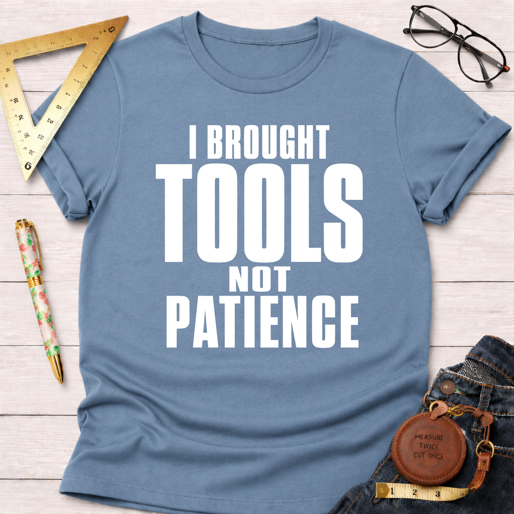 Women's funny woodworking graphic tee shirt for female woodworkers, makers, and DIY builders — Sawdust & Ponytails. Light blue cotton tee with "I BROUGHT TOOLS NOT PATIENCE" in white text.