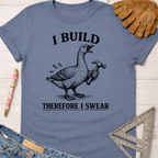 Women's funny woodworking graphic tee shirt for female woodworkers, makers, and DIY builders — Sawdust & Ponytails. Blue cotton tee with a goose holding a hammer and "I BUILD THEREFORE I SWEAR" text.