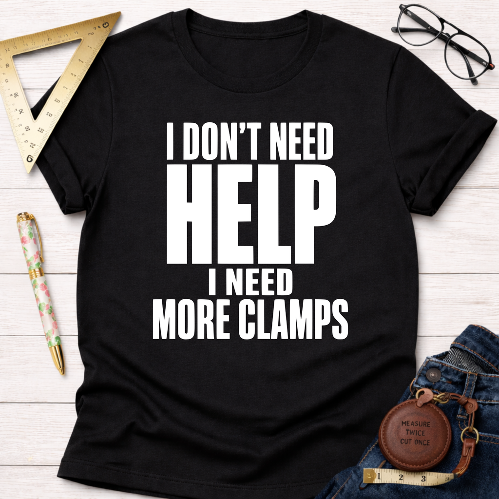Black cotton unisex t-shirt with "I Don't Need HELP I Need MORE CLAMPS" in white text.