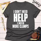 Charcoal grey unisex t-shirt with "I Don't Need Help. I Need More Clamps." in white text.