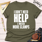 Olive green unisex t-shirt with "I Don't Need HELP I Need More CLAMPS" in white text.