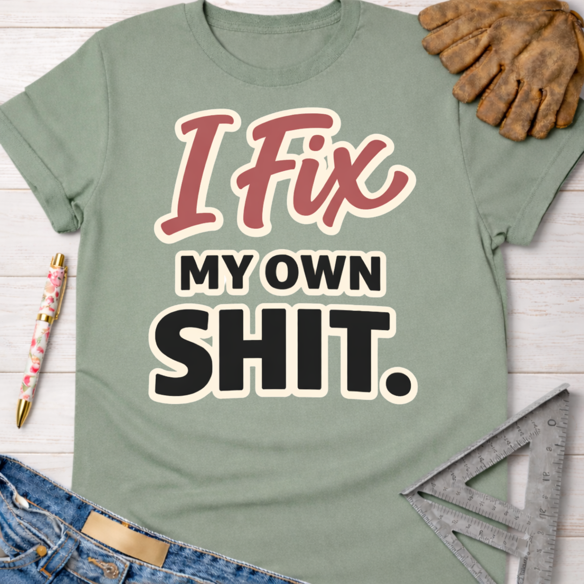 Women's funny woodworking graphic tee shirt for female woodworkers, makers, and DIY builders — Sawdust & Ponytails. Sage green cotton tee with "I Fix My Own Shit" graphic.