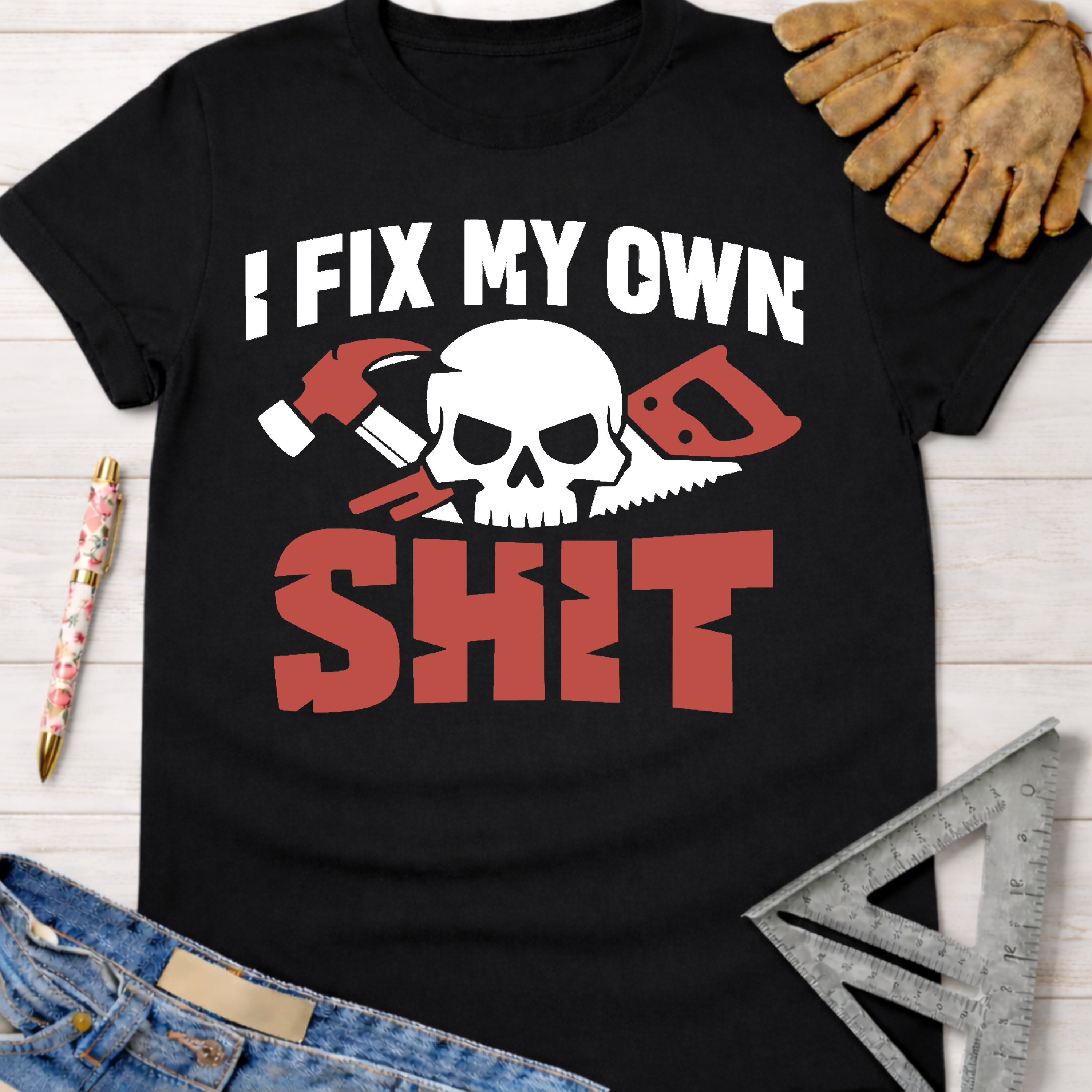 Black cotton t-shirt with "I FIX MY OWN SHIT" text, skull, hammer, and saw graphic. Women's funny woodworking graphic tee shirt for female woodworkers, makers, and DIY builders — Sawdust & Ponytails