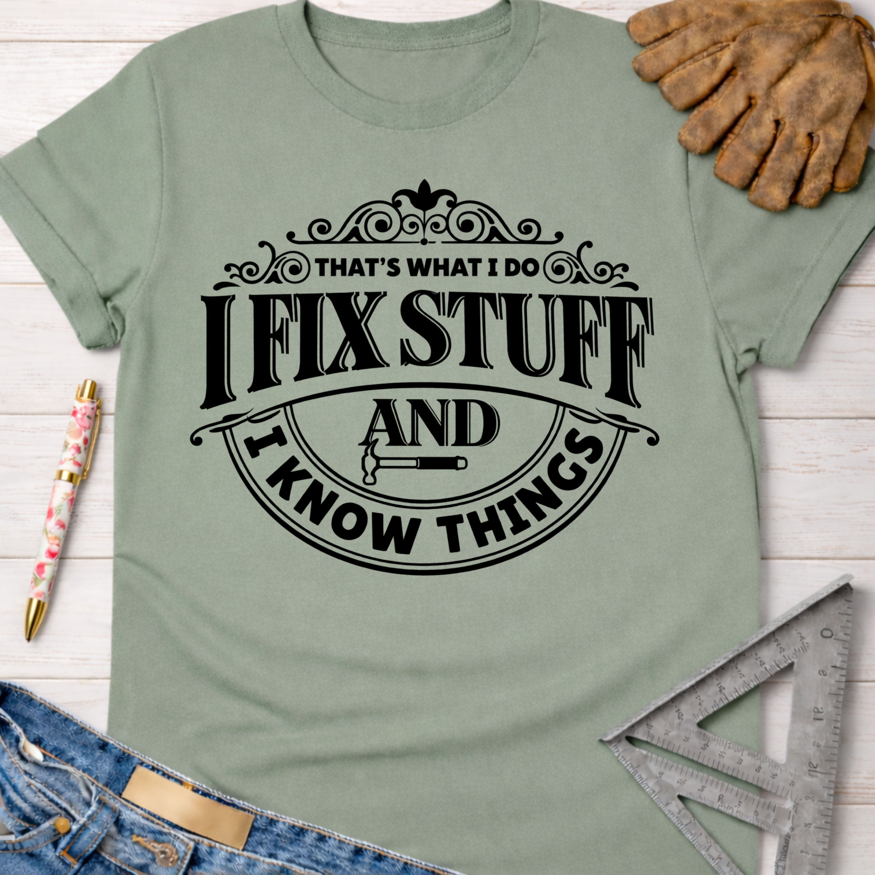 Women's funny woodworking graphic tee shirt for female woodworkers, makers, and DIY builders — Sawdust & Ponytails. Sage green cotton tee with "I Fix Stuff And I Know Things" graphic.
