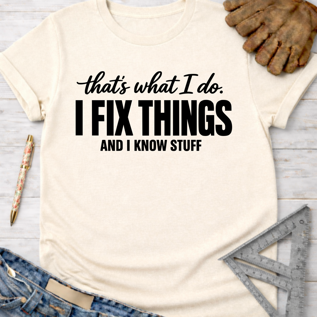 Women's funny woodworking graphic tee shirt for female woodworkers, makers, and DIY builders — Sawdust & Ponytails. Cream t-shirt with "I Fix Things And Know Stuff" in black text.