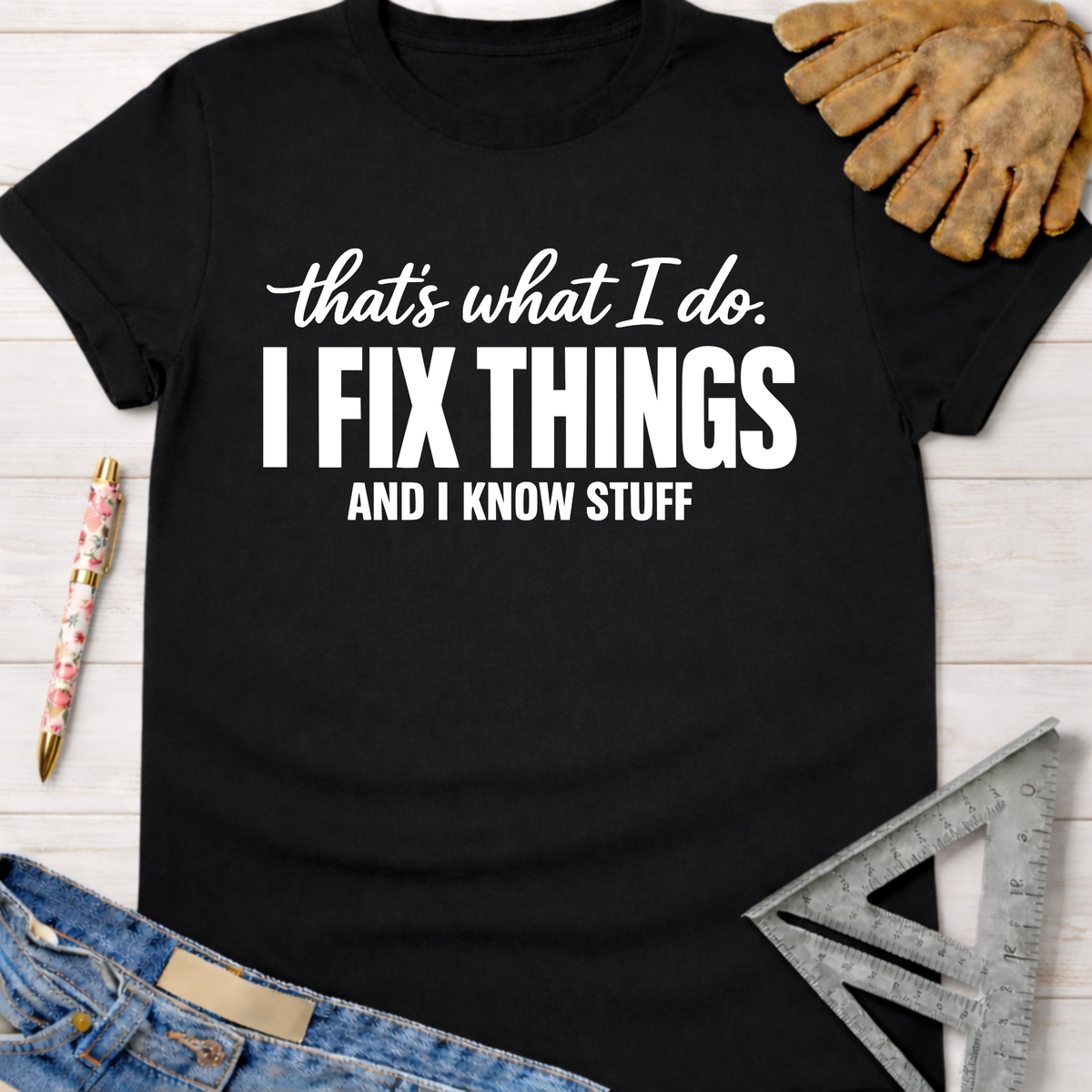 Women's funny woodworking graphic tee shirt for female woodworkers, makers, and DIY builders — Sawdust & Ponytails. Black cotton tee with "I Fix Things And I Know Stuff" in white text.
