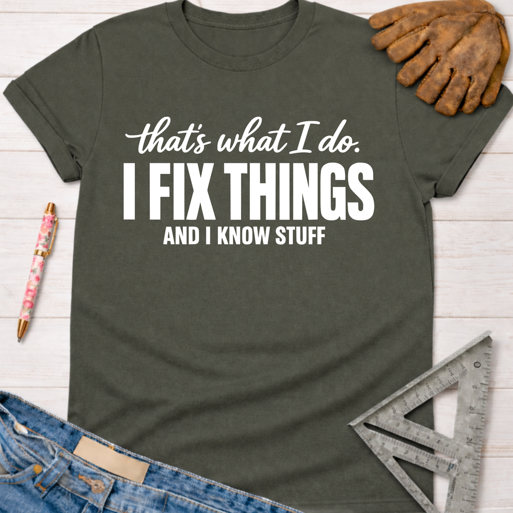 Women's funny woodworking graphic tee shirt for female woodworkers, makers, and DIY builders — Sawdust & Ponytails. Dark gray cotton tee with "I FIX THINGS AND I KNOW STUFF" in white text.