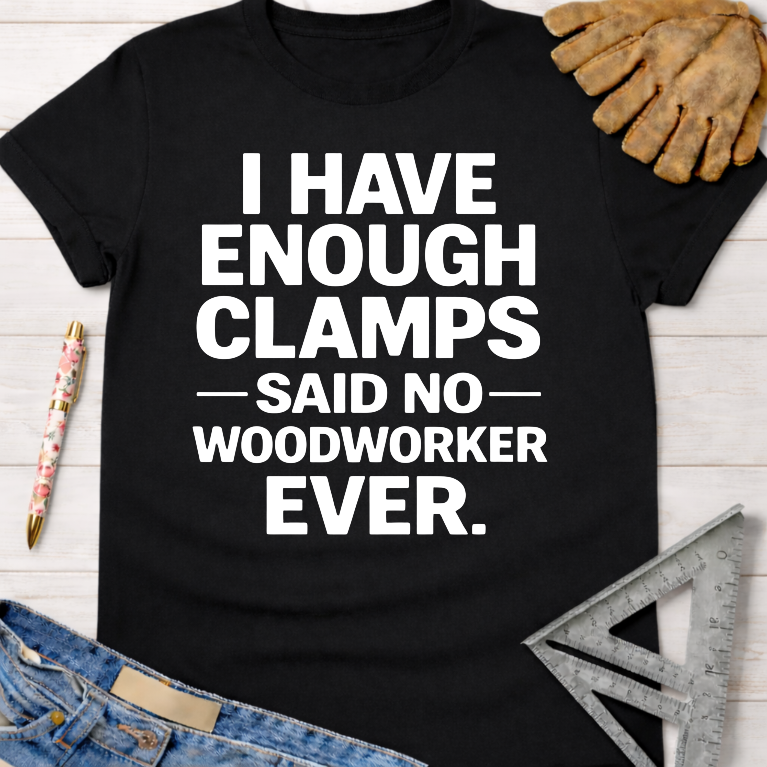Women's funny woodworking graphic tee shirt for female woodworkers, makers, and DIY builders — Sawdust & Ponytails. Black cotton tee with "I Have Enough Clamps - Said No - Woodworker Ever" in white text.