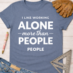 Women's funny woodworking graphic tee shirt for female woodworkers, makers, and DIY builders — Sawdust & Ponytails. Blue cotton tee with "I LIKE WORKING ALONE more than PEOPLE" in white text.
