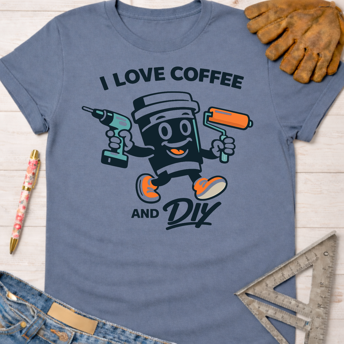 Women's funny woodworking graphic tee shirt for female woodworkers, makers, and DIY builders — Sawdust & Ponytails. Blue cotton tee with "I Love Coffee and DIY" graphic featuring a coffee cup holding a drill and paint roller.