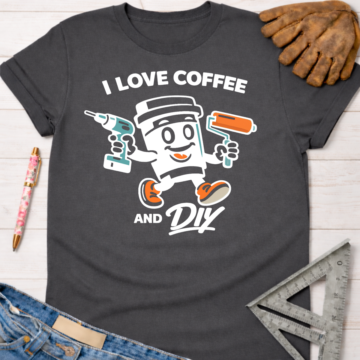 Women's funny woodworking graphic tee shirt for female woodworkers, makers, and DIY builders — Sawdust & Ponytails. Dark gray cotton tee with "I Love Coffee and DIY" graphic.