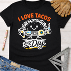 Black cotton tee with "I Love Tacos and DIY" graphic featuring a taco holding tools. Women's funny woodworking graphic tee shirt for female woodworkers, makers, and DIY builders — Sawdust & Ponytails.