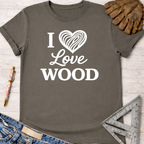 Women's funny woodworking graphic tee shirt for female woodworkers, makers, and DIY builders — Sawdust & Ponytails. Dark gray cotton t-shirt with "I Love Wood" in white text and a wood grain heart.