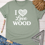 Women's funny woodworking graphic tee shirt for female woodworkers, makers, and DIY builders — Sawdust & Ponytails. Sage green cotton t-shirt with "I Love Wood" graphic.