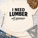 Women's funny woodworking graphic tee shirt for female woodworkers, makers, and DIY builders — Sawdust & Ponytails. Cream t-shirt with "I NEED LUMBER not opinions" in black text.
