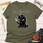 Olive green t-shirt with an angry black unicorn holding a knife and "i require tools" text.