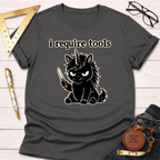 Charcoal gray t-shirt with a black angry unicorn holding a knife and "i require tools" text.