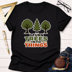 Black cotton t-shirt with "I Turn Trees Into Things" graphic and tree illustrations.