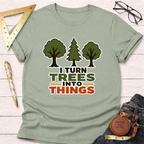Light green cotton t-shirt with "I Turn Trees Into Things" text and three tree graphics.