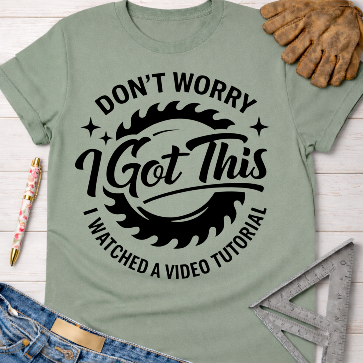 Women's funny woodworking graphic tee shirt for female woodworkers, makers, and DIY builders — Sawdust & Ponytails. Sage green cotton tee with "Don't Worry I Got This I Watched A Video Tutorial" graphic.
