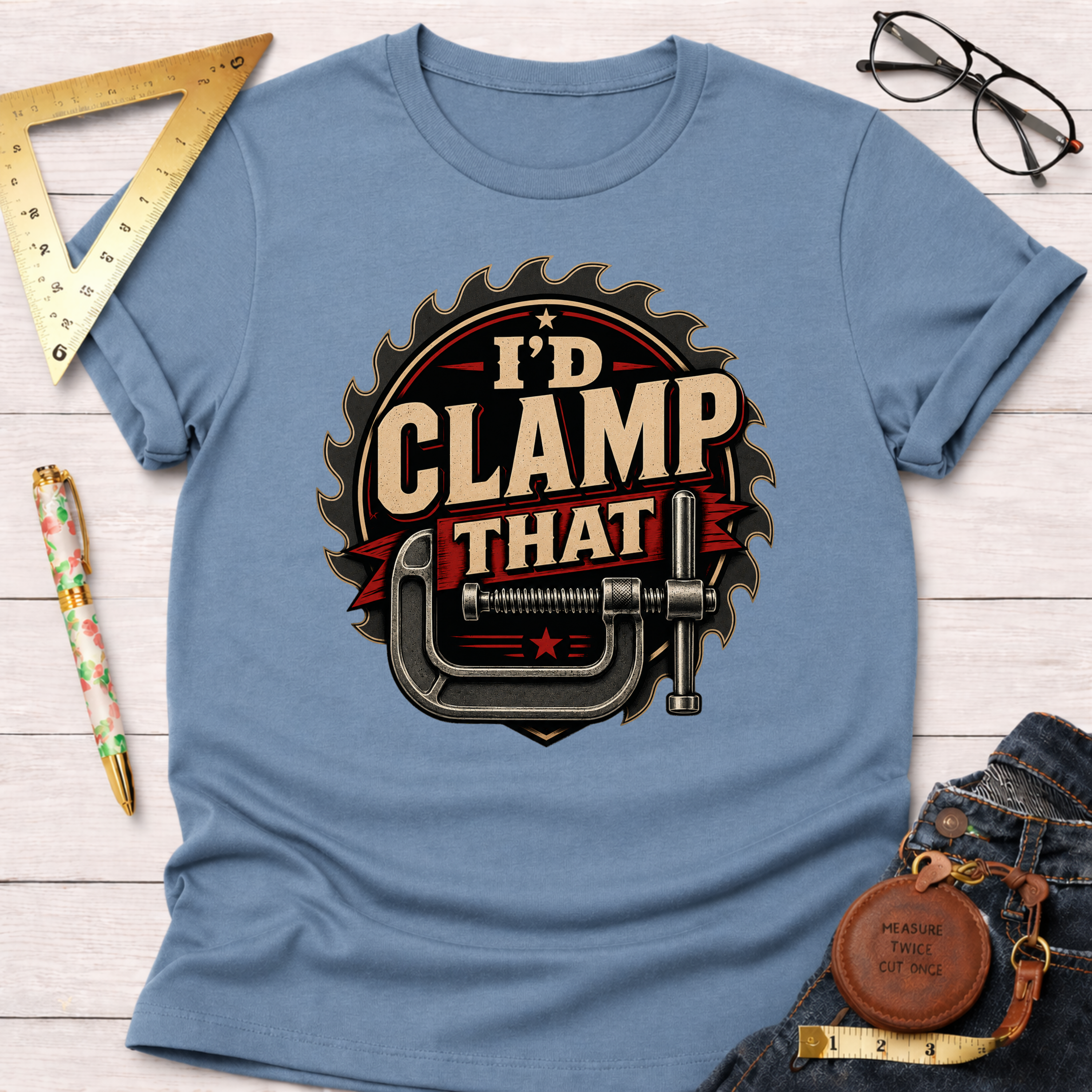 Light blue "I'd Clamp That" graphic t-shirt with a saw blade and C-clamp design.