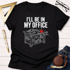 Black cotton t-shirt with "I'LL BE IN MY OFFICE" text and a white line art workbench design.