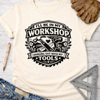 Women's funny woodworking graphic tee shirt for female woodworkers, makers, and DIY builders — Sawdust & Ponytails. Cream t-shirt with "I'll Be In My Workshop Hanging Out With My Tools" graphic featuring hammer, drill, and saw.