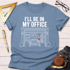 Light blue t-shirt with "I'LL BE IN MY OFFICE" above a detailed garage workshop graphic with a red mug.