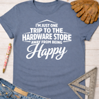 Women's funny woodworking graphic tee shirt for female woodworkers, makers, and DIY builders — Sawdust & Ponytails. Blue short-sleeve tee with "I'm Just One Trip Away From Being Happy" text.
