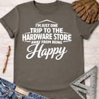 Women's funny woodworking graphic tee shirt for female woodworkers, makers, and DIY builders — Sawdust & Ponytails. Dark gray cotton tee with "I'm Just One Trip To The Hardware Store Away From Being Happy" in white text.