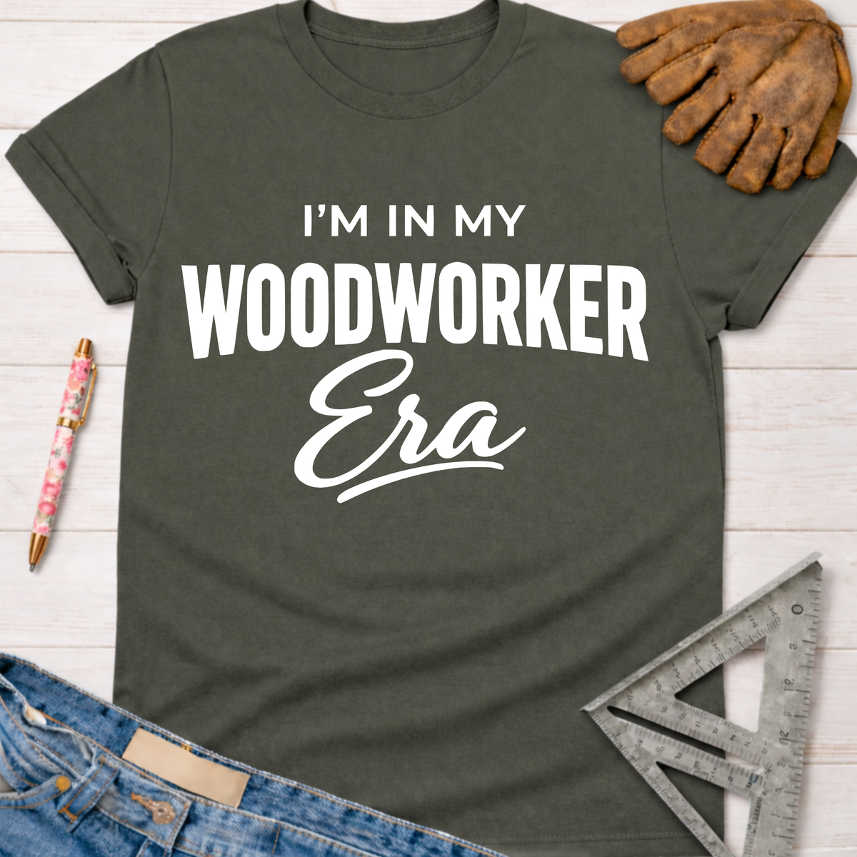 Women's funny woodworking graphic tee shirt for female woodworkers, makers, and DIY builders — Sawdust & Ponytails. Dark gray cotton "I'm in My Woodworker Era" graphic tee.