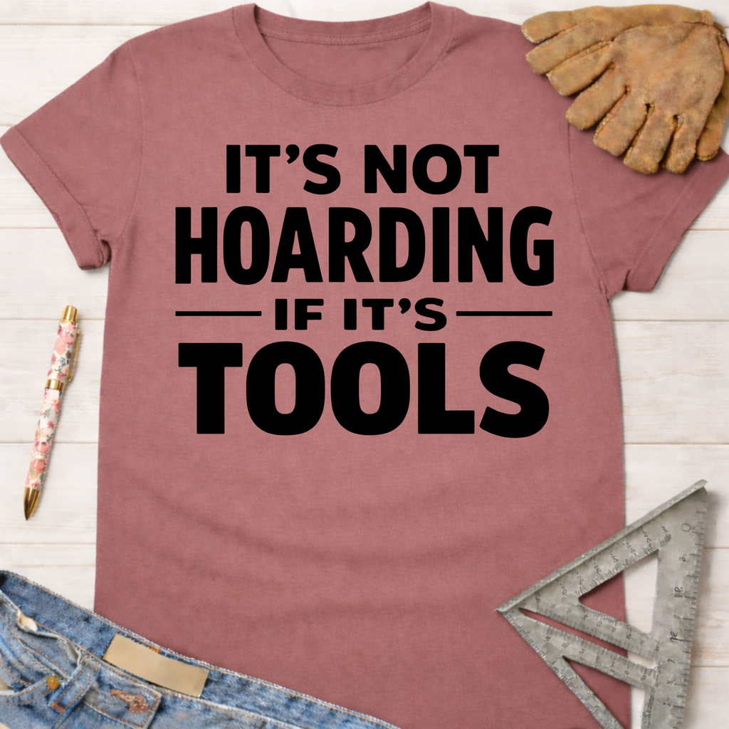 Women's funny woodworking graphic tee shirt for female woodworkers, makers, and DIY builders — Sawdust & Ponytails. Mauve cotton t-shirt with "IT'S NOT HOARDING IF IT'S TOOLS" in black text.