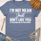 Women's funny woodworking graphic tee shirt for female woodworkers, makers, and DIY builders — Sawdust & Ponytails. Blue cotton tee with "I'm Not Mean Just Don't Like You I'd Rather Be In The Shop" text.