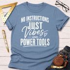 Light blue crew neck t-shirt with "No Instructions Just Vibes And Power Tools" in white text.